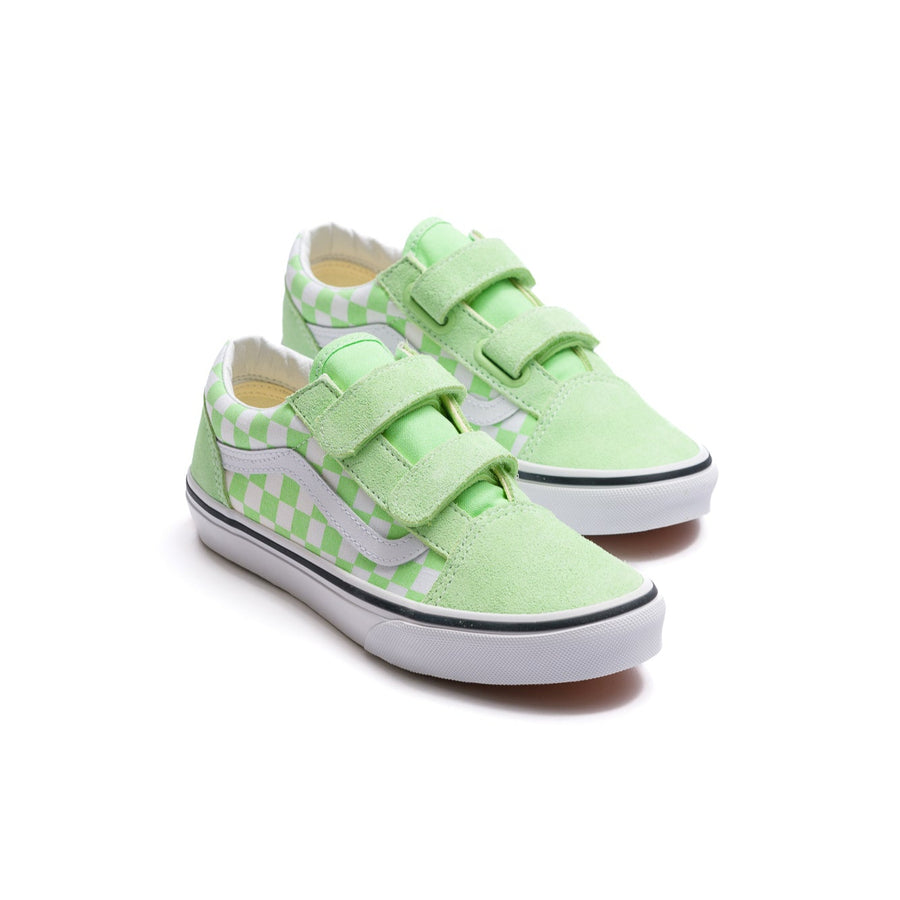 green kids vans old skool with velcro, a white side stripe, checkerboard green and white side panel and white sole.