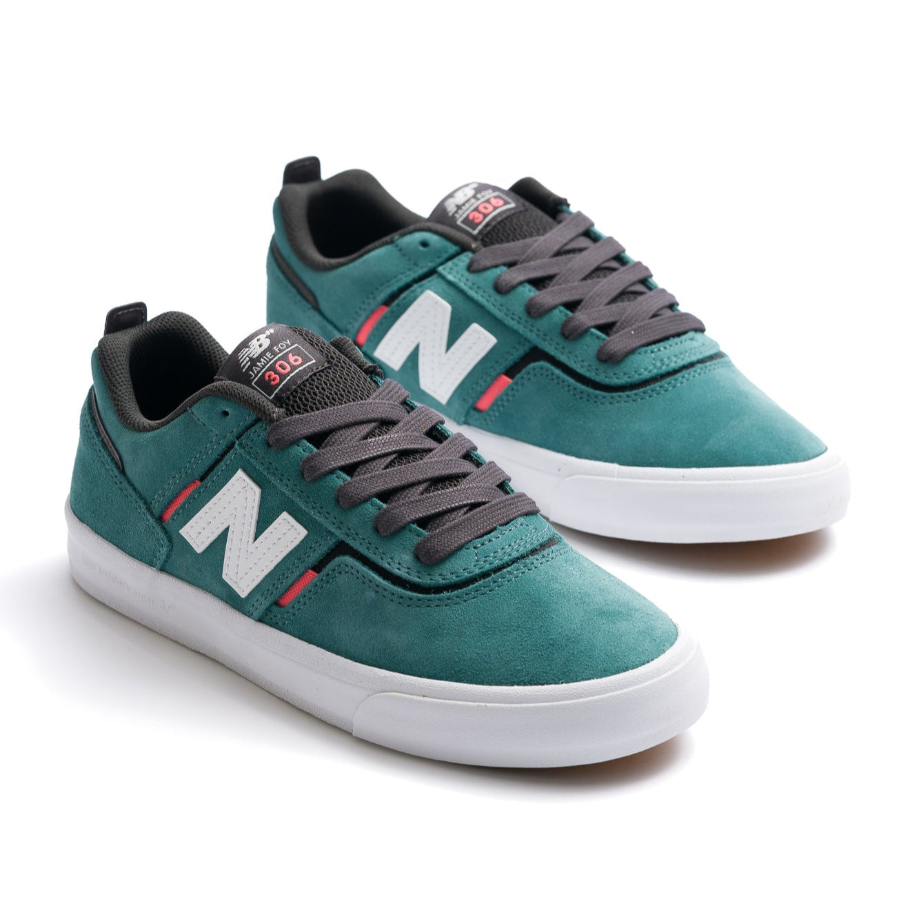 green new balance numeric jamie foy 306 with pink highlights, white N logo and white sole men's skate shoe