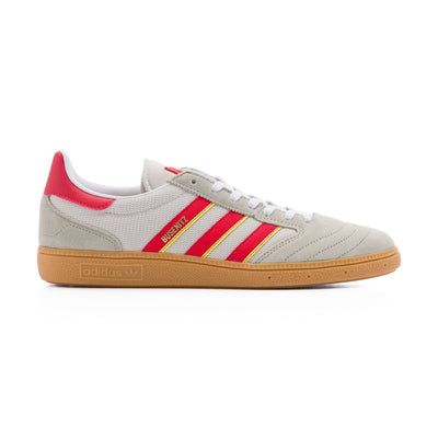 Grey adidas men's busenitz vintage skate shoe with three red and yellow stripes and gum sole