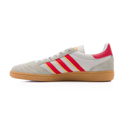 Grey adidas men's busenitz vintage skate shoe with three red and yellow stripes and gum sole