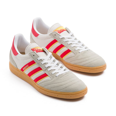 Grey adidas men's busenitz vintage skate shoe with three red and yellow stripes and gum sole