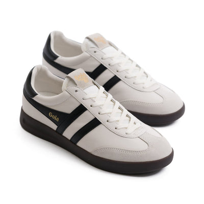 white gola women's shoe with black stripes and black sole