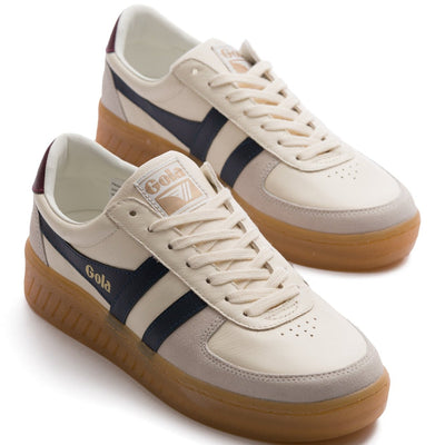 grey and white gola mens grandslam elite sneaker with black logo and gum sole