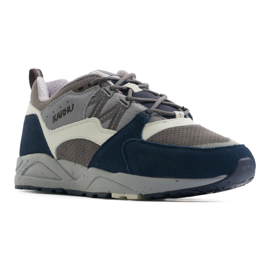 blue grey and white karhu men's comfort shoe with a grey speckled sole