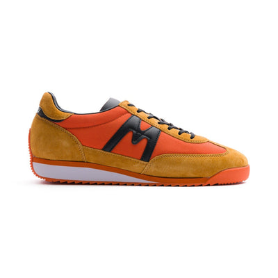 two tone orange men's mestari karhu shoes with black detail and orange and white sole