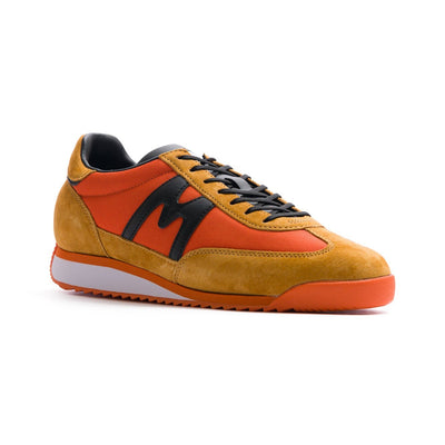 two tone orange men's mestari karhu shoes with black detail and orange and white sole