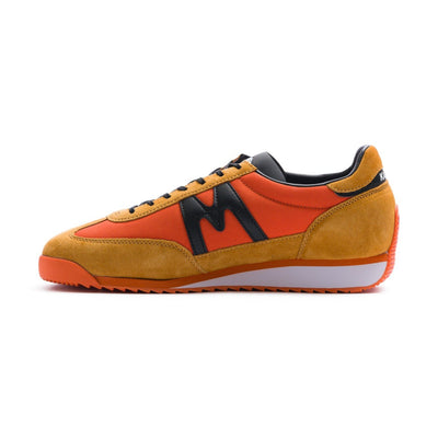 two tone orange men's mestari karhu shoes with black detail and orange and white sole