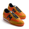 two tone orange men's mestari karhu shoes with black detail and orange and white sole