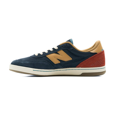 navy blue new balance numeric men's 440v2 with brown N, red heel, and white sole