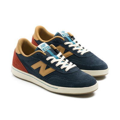 navy blue new balance numeric men's 440v2 with brown N, red heel, and white sole