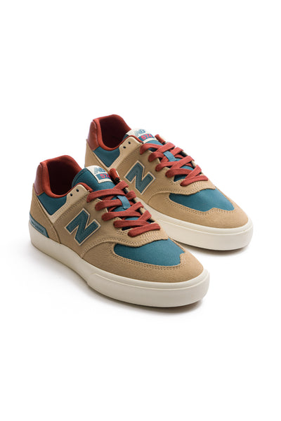 tan and green men's new balance numeric with off-white sole and reddish laces and back