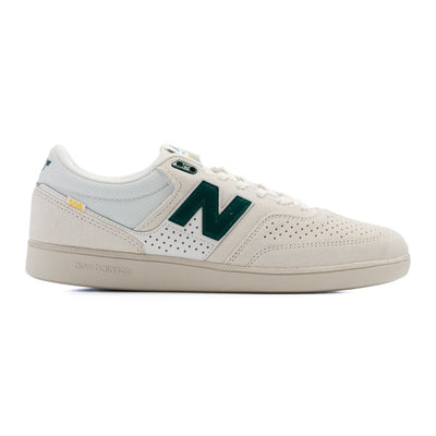 grey and white new balance men's shoe with grey sole and forest green detail