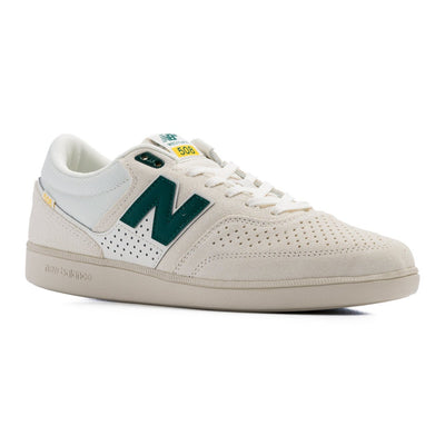 grey and white new balance men's shoe with grey sole and forest green detail