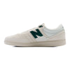 grey and white new balance men's shoe with grey sole and forest green detail