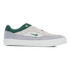 grey nike sb men's malor skate shoe with green detail and white sole