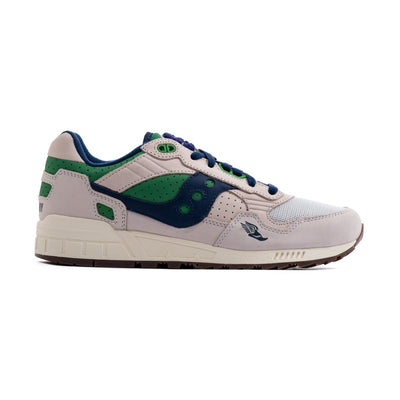 grey saucony men's shoe with green and navy blue details