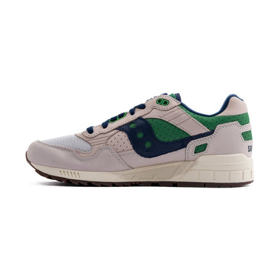 grey saucony men's shoe with green and navy blue details