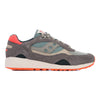 green and grey saucony shadow 6000 women'sand men's comfort shoe with green and orange detail and an off white sole