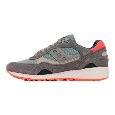 green and grey saucony shadow 6000 women'sand men's comfort shoe with green and orange detail and an off white sole