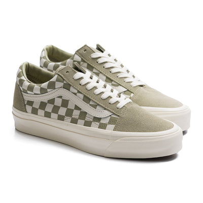 green and white checkerboard women's vans shoe with white sidestripe and white sole