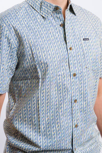 white and blue greek like pattern volcom short sleeve men's button-up shirt