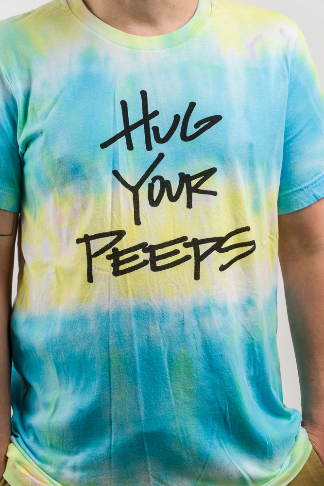 Hand Dyed tee shirt featuring the slogan Hug your peeps Tie Dye Tee