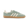 light green adidas samba adv with white stripes and a gum sole