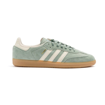 light green adidas samba adv with white stripes and a gum sole