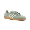 light green adidas samba adv with white stripes and a gum sole