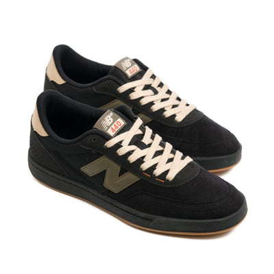 black and green new balance men's shoe in standard and wide