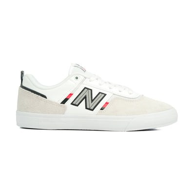 white men's new balance shoe with read and black details and a white sole