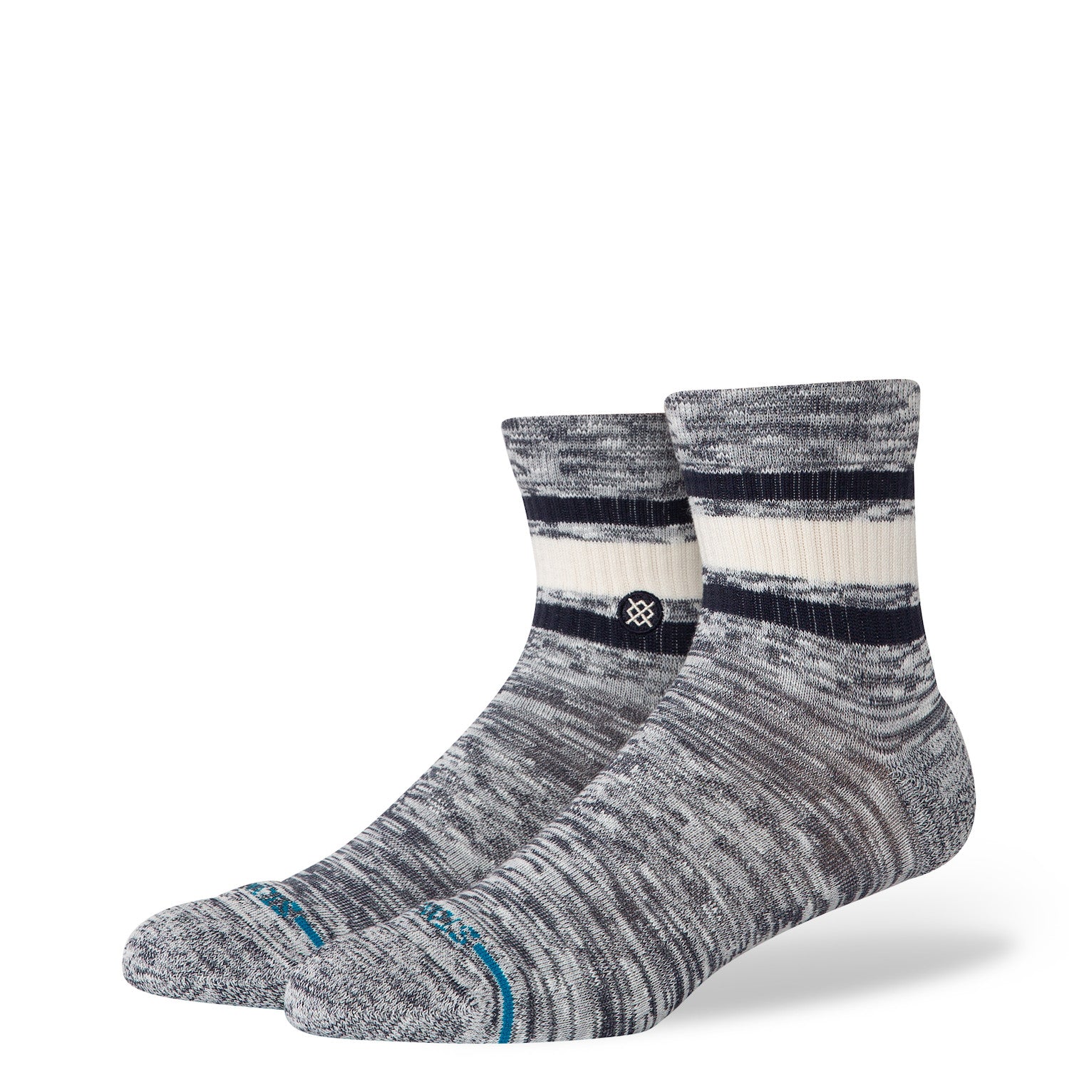 Pair of gray and white socks with a stance logo on a white background