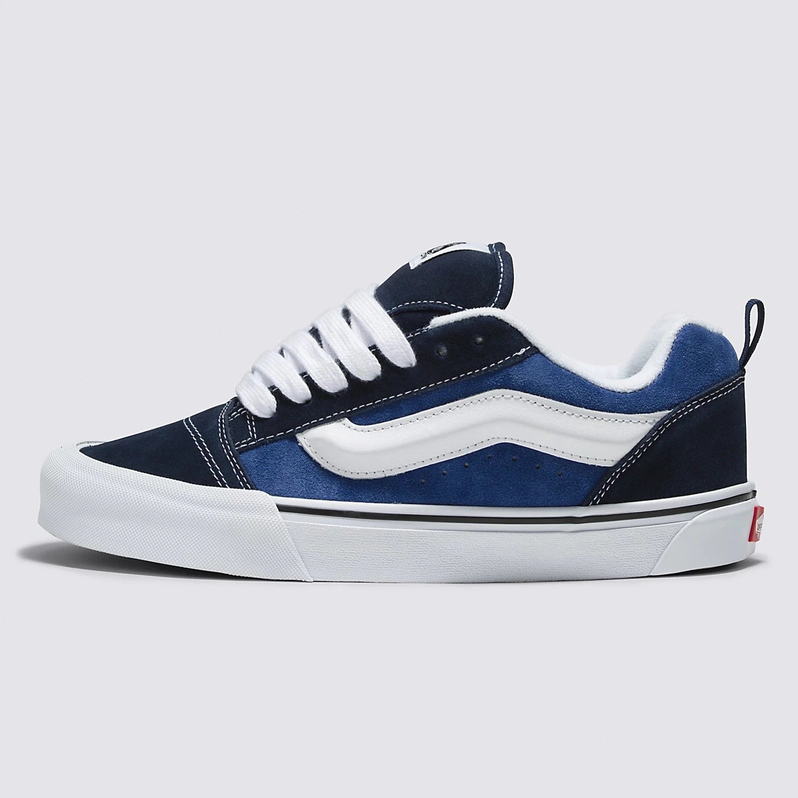 navy blue men's and women's knu skool shoe with white sidestripe and white sole