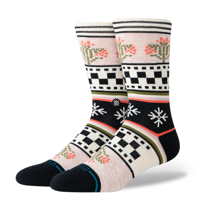 Pair of patterned stance women's crew socks with black, white, and multicolor design on a transparent background