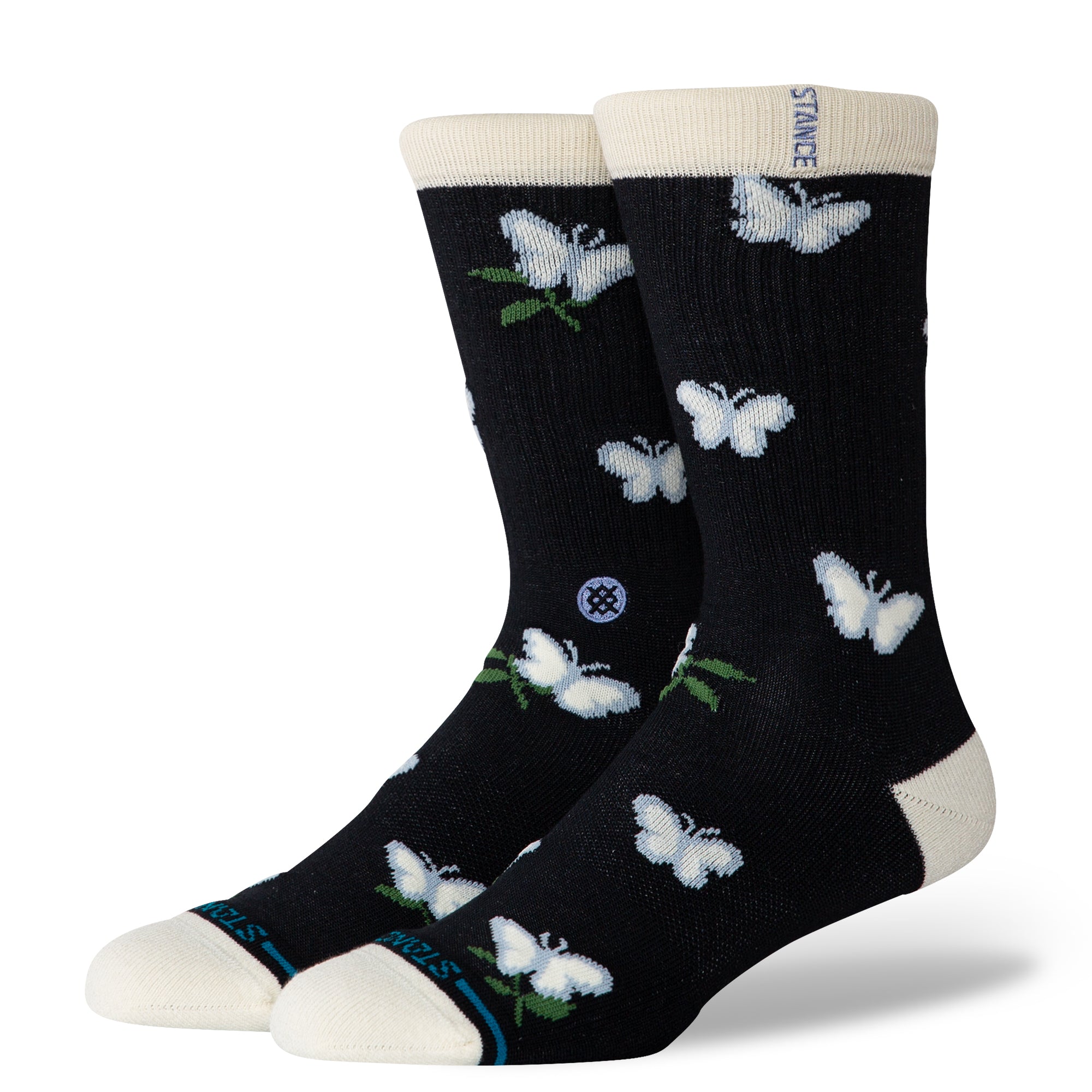 Black stance butterblend meadow socks with white butterfly patterns on a white background