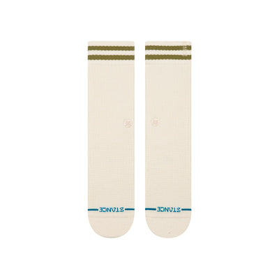 Pair of cream stance women's butterblend crew socks with green stripes on a white background