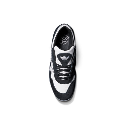 Black and white adidas x gustav tonnesen aloha sneaker with Adidas logo and a clear sole on a white background
