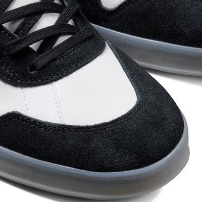 Black and white adidas x gustav tonnesen aloha sneaker with Adidas logo and a clear sole on a white background