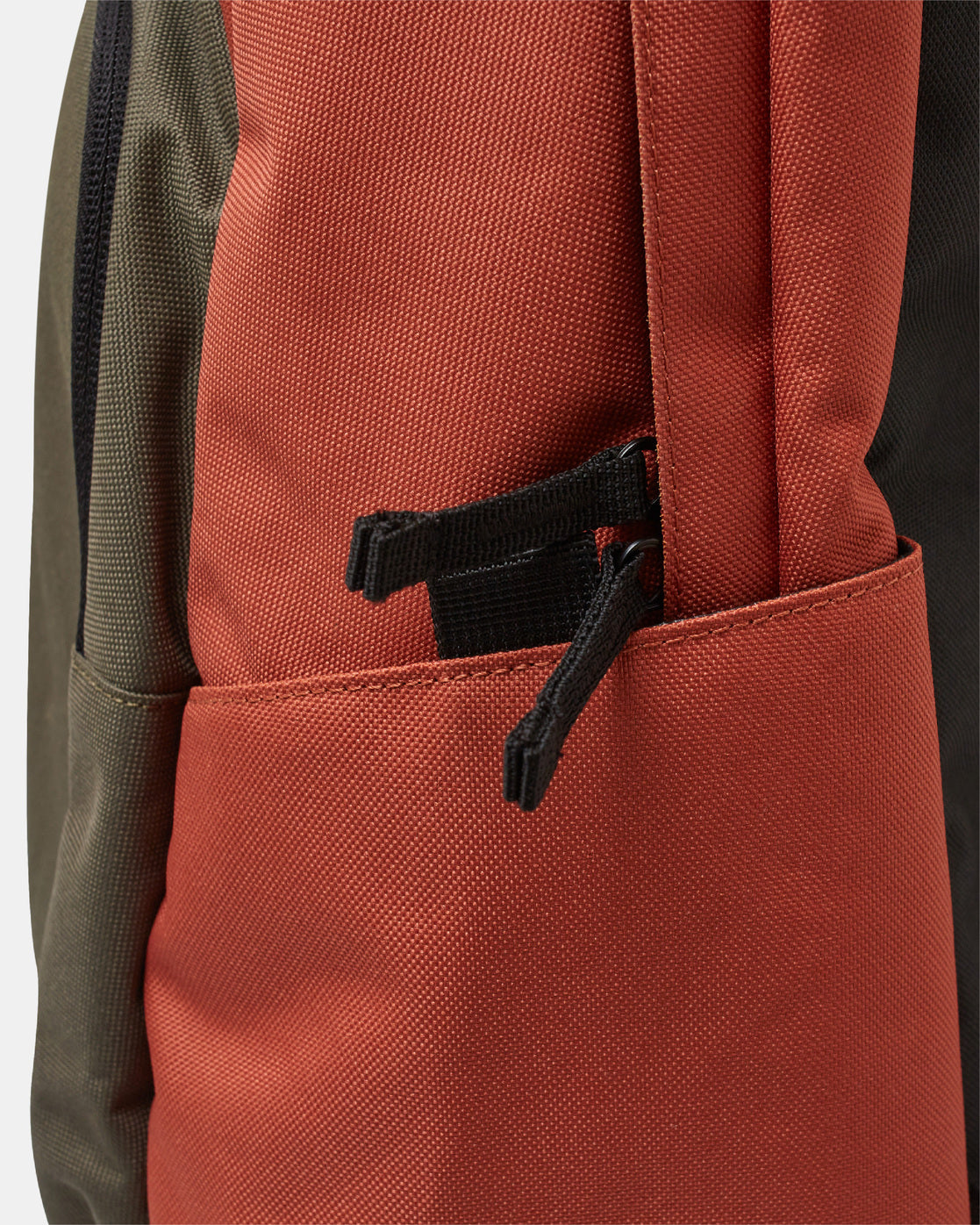 orange backpack with green front pocket rvca