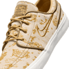 tan and gold city of style nike sb janoski low top men's skate shoe with all over print and white sole