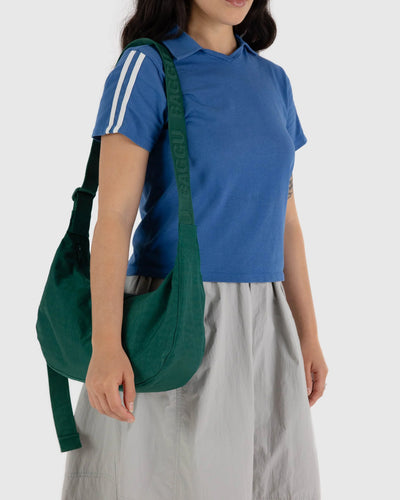 green nylon crescent shaped baggu bag