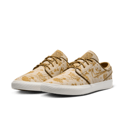tan and gold city of style nike sb janoski low top men's skate shoe with all over print and white sole