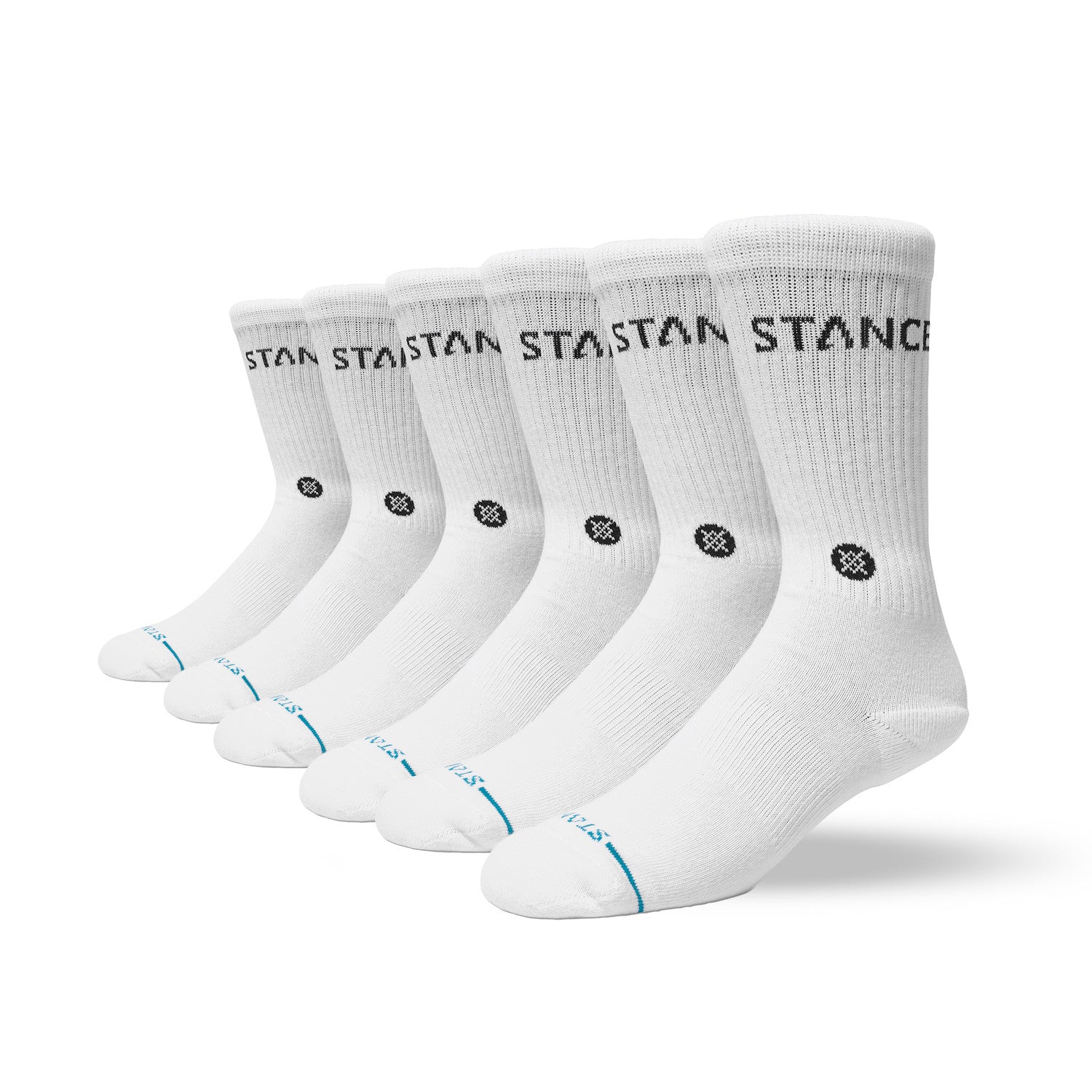 Set of six white stances socks with black branding on a white background