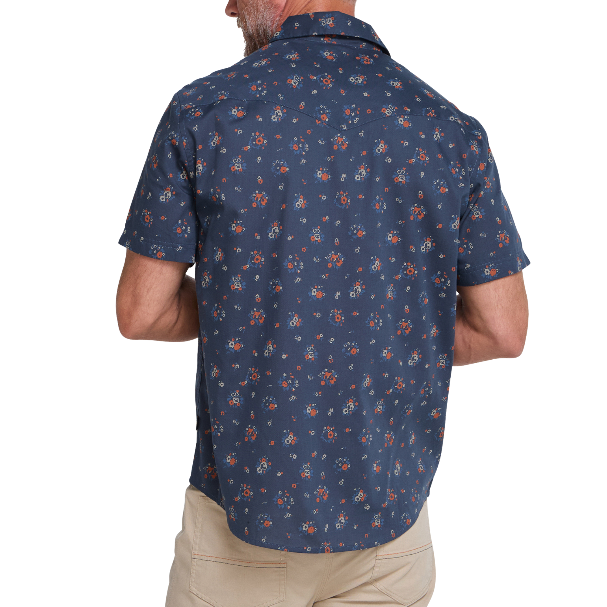 a man wearing a Holwer Brothers H Bar B Snapshirt Bouquets in a midnight blue wiht small all-over floral print on a white background