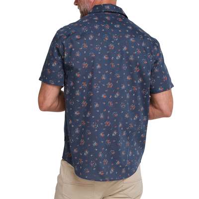 a man wearing a Holwer Brothers H Bar B Snapshirt Bouquets in a midnight blue wiht small all-over floral print on a white background