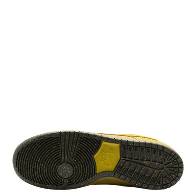 sole of A Nike SB Saffron Dunk Low sneaker in a yellow, tan, and sage green colorway, against a plain white background.