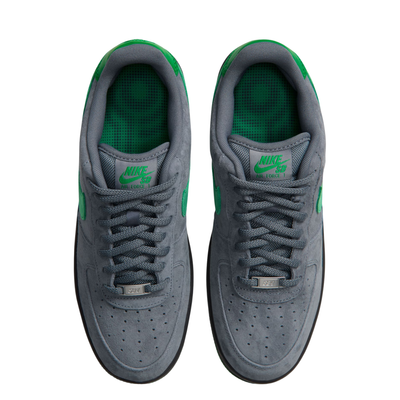 grey nike sb x nocturnal air force 1 with green swoosh and black and green sole on a white background