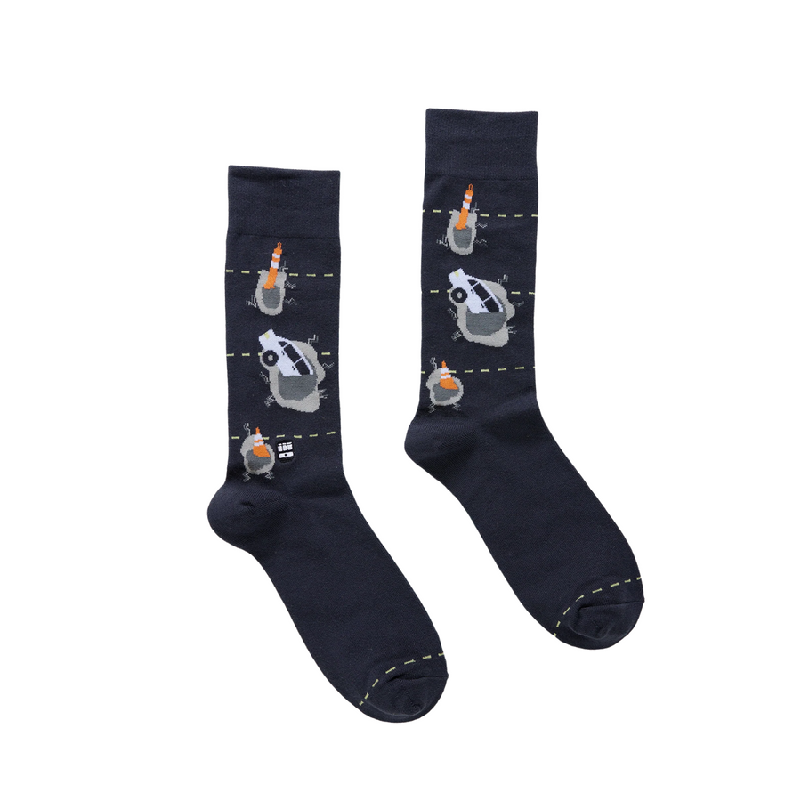 Pair of dark blue bonfolk pothole socks on a white background