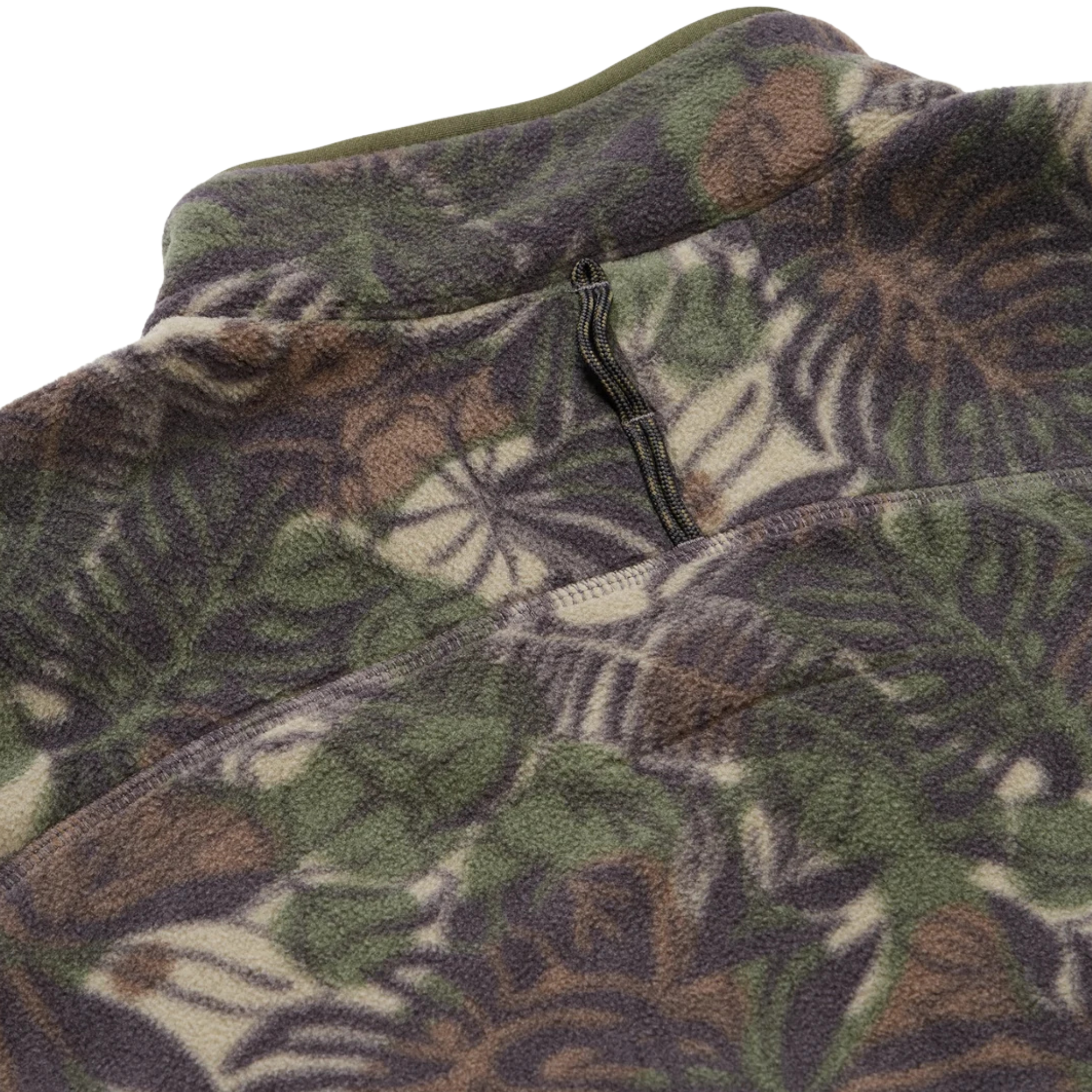 close up of A long-sleeve quarter-zip howler brothers pullover fleece, featuring a dark green and brown tropical leaf camouflage pattern. It has a black chest pocket with a white and red Howler logo patch, a stand-up collar, and zippered hand pockets.