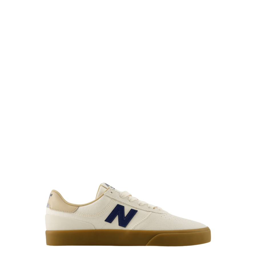 A New Balance numeric 272 skateboard sneaker in off-white leather with a navy blue 'N' logo, beige heel tab, and a brown gum sole, shown from a side profile on a white background.